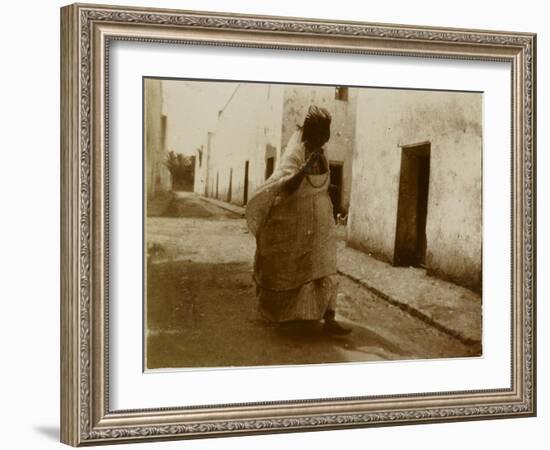 Voyage en Algérie : femme marchant dans une rue de Biskra-Henri Jacques Edouard Evenepoel-Framed Giclee Print