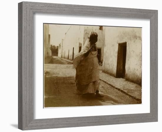 Voyage en Algérie : femme marchant dans une rue de Biskra-Henri Jacques Edouard Evenepoel-Framed Giclee Print