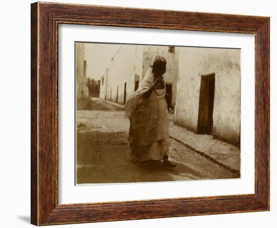 Voyage en Algérie : femme marchant dans une rue de Biskra-Henri Jacques Edouard Evenepoel-Framed Giclee Print