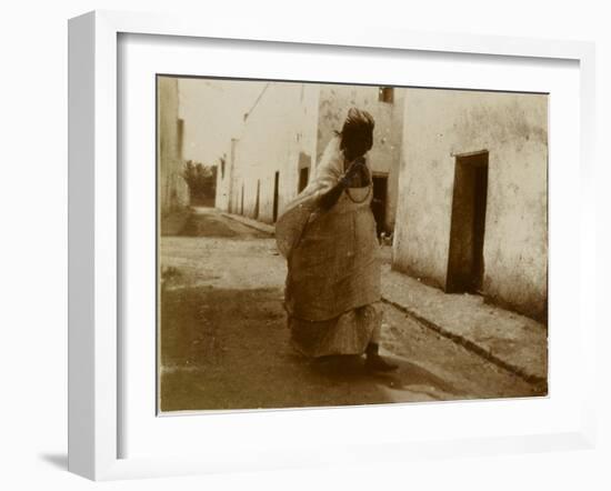 Voyage en Algérie : femme marchant dans une rue de Biskra-Henri Jacques Edouard Evenepoel-Framed Giclee Print