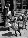 Victoria Cooper's Children Peering in Window Where Newborn Baby Lies in Crib Made from Fruit Crate-W^ Eugene Smith-Framed Photographic Print