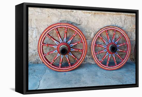 Wagon Wheel . Close-Up of an Antique Wagon Wheel Located in A Fortress.-maggee-Framed Premier Image Canvas