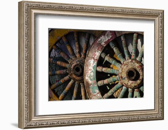 Wagon wheels at antiques store.-Larry Ditto-Framed Photographic Print