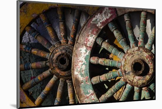 Wagon wheels at antiques store.-Larry Ditto-Mounted Photographic Print