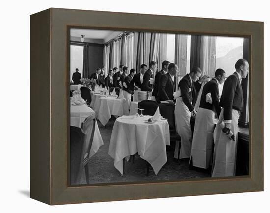 Waiters at the Grand Hotel Line Up at the Windows to Watch Sonja Henie Ice Skate Outside-Alfred Eisenstaedt-Framed Premier Image Canvas