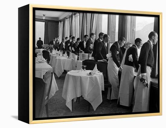 Waiters at the Grand Hotel Line Up at the Windows to Watch Sonja Henie Ice Skate Outside-Alfred Eisenstaedt-Framed Premier Image Canvas