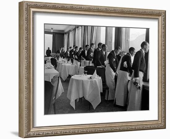 Waiters at the Grand Hotel Line Up at the Windows to Watch Sonja Henie Ice Skate Outside-Alfred Eisenstaedt-Framed Photographic Print