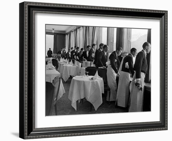 Waiters at the Grand Hotel Line Up at the Windows to Watch Sonja Henie Ice Skate Outside-Alfred Eisenstaedt-Framed Photographic Print