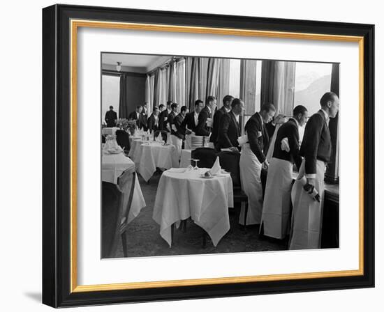 Waiters at the Grand Hotel Line Up at the Windows to Watch Sonja Henie Ice Skate Outside-Alfred Eisenstaedt-Framed Photographic Print