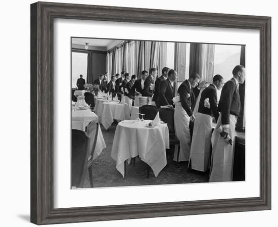 Waiters in the Grand Hotel Dining Room Lined Up at Window Watching Sonja Henie Ice Skating Outside-Alfred Eisenstaedt-Framed Photographic Print