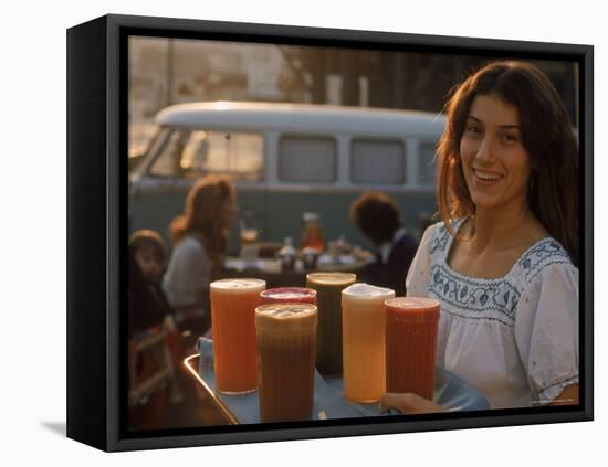 Waitress Carrying Tray of Carrot, Celery. Beet, Orange, Apple, and Grapefruit Juice at "The Source"-Michael Rougier-Framed Premier Image Canvas