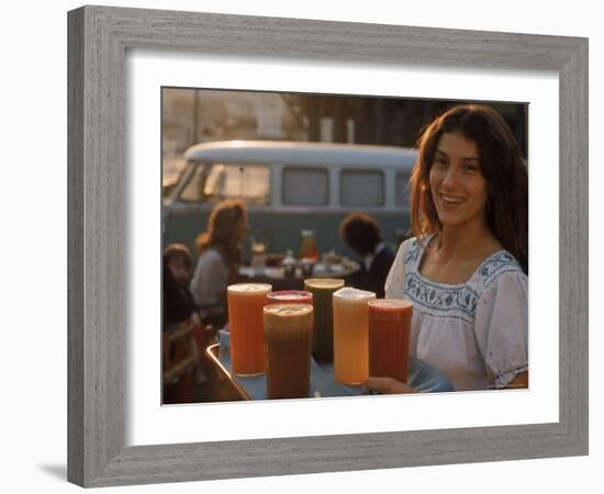 Waitress Carrying Tray of Carrot, Celery. Beet, Orange, Apple, and Grapefruit Juice at "The Source"-Michael Rougier-Framed Photographic Print