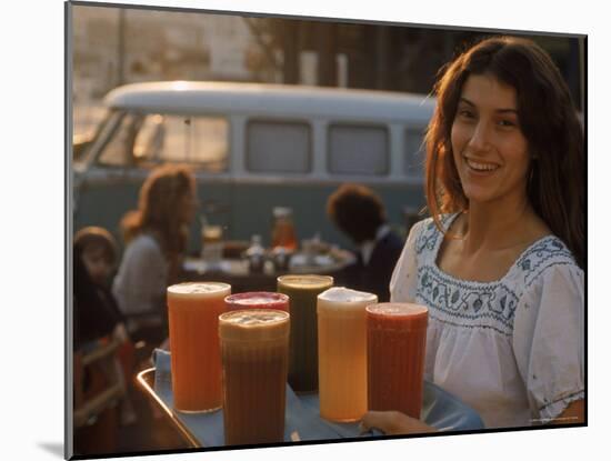 Waitress Carrying Tray of Carrot, Celery. Beet, Orange, Apple, and Grapefruit Juice at "The Source"-Michael Rougier-Mounted Photographic Print