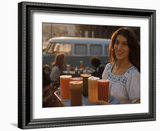 Waitress Carrying Tray of Carrot, Celery. Beet, Orange, Apple, and Grapefruit Juice at "The Source"-Michael Rougier-Framed Photographic Print