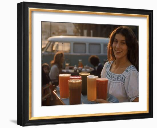Waitress Carrying Tray of Carrot, Celery. Beet, Orange, Apple, and Grapefruit Juice at "The Source"-Michael Rougier-Framed Photographic Print