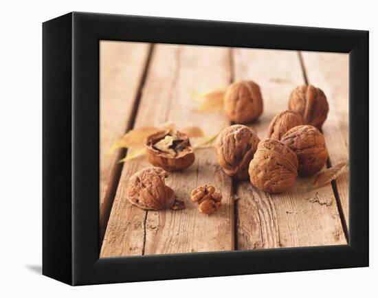 Walnuts on a Wooden Background-Matthias Hoffmann-Framed Premier Image Canvas