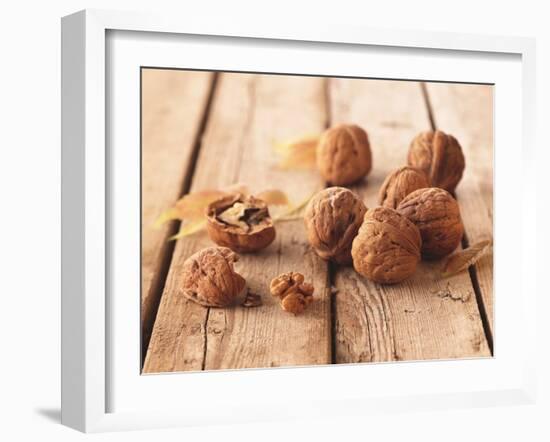 Walnuts on a Wooden Background-Matthias Hoffmann-Framed Photographic Print