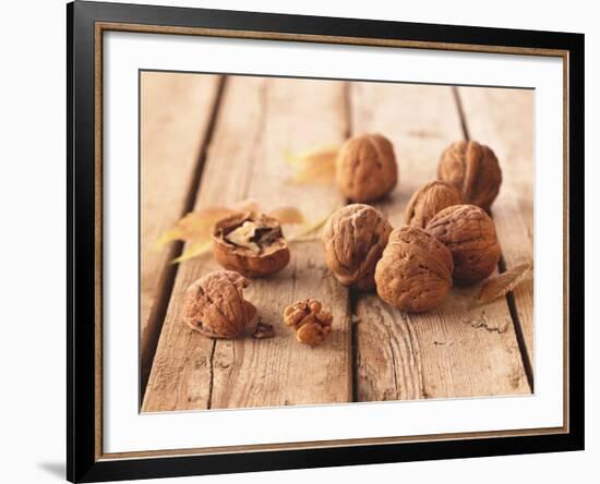 Walnuts on a Wooden Background-Matthias Hoffmann-Framed Photographic Print