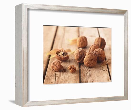 Walnuts on a Wooden Background-Matthias Hoffmann-Framed Photographic Print