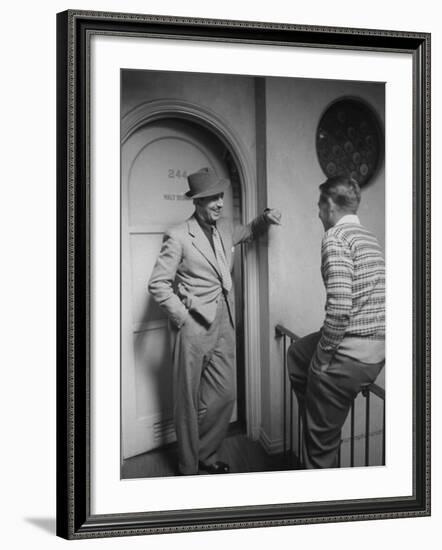 Walt Disney Chatting with Unidentified Man in Hallway Outside of His Office-Alfred Eisenstaedt-Framed Premium Photographic Print