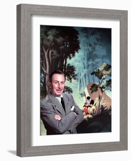 Walt Disney Posing Against Landscape Backdrop Containing Mickey Mouse-Alfred Eisenstaedt-Framed Premium Photographic Print