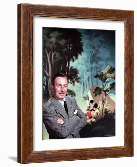 Walt Disney Posing Against Landscape Backdrop Containing Mickey Mouse-Alfred Eisenstaedt-Framed Premium Photographic Print