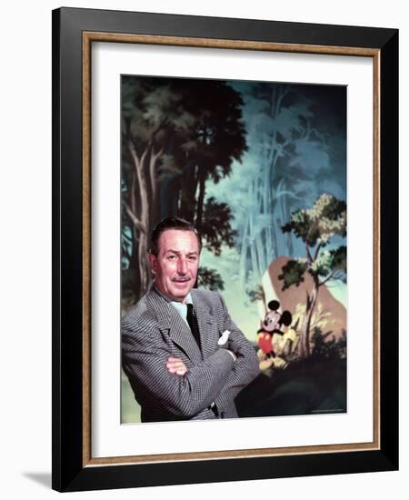 Walt Disney Posing Against Landscape Backdrop Containing Mickey Mouse-Alfred Eisenstaedt-Framed Premium Photographic Print