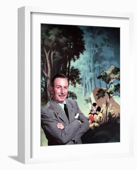 Walt Disney Posing Against Landscape Backdrop Containing Mickey Mouse-Alfred Eisenstaedt-Framed Premium Photographic Print