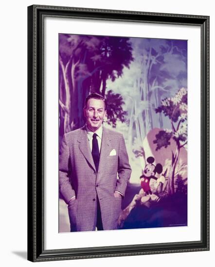 Walt Disney Posing Against Landscape Backdrop Containing Mickey Mouse-Alfred Eisenstaedt-Framed Premium Photographic Print