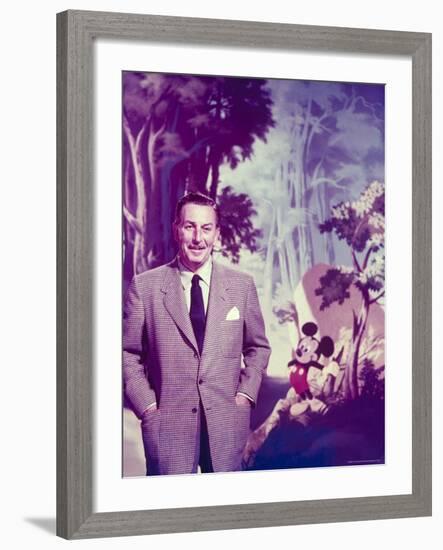 Walt Disney Posing Against Landscape Backdrop Containing Mickey Mouse-Alfred Eisenstaedt-Framed Premium Photographic Print