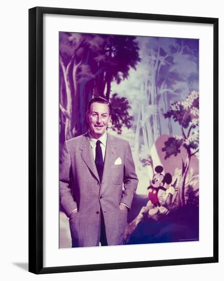 Walt Disney Posing Against Landscape Backdrop Containing Mickey Mouse-Alfred Eisenstaedt-Framed Premium Photographic Print