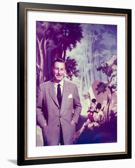 Walt Disney Posing Against Landscape Backdrop Containing Mickey Mouse-Alfred Eisenstaedt-Framed Premium Photographic Print