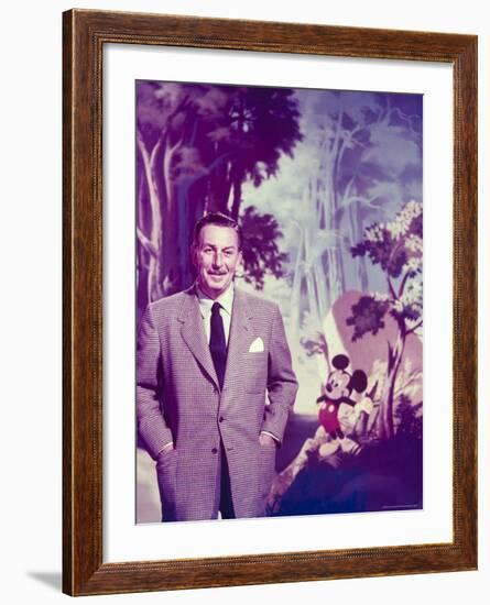 Walt Disney Posing Against Landscape Backdrop Containing Mickey Mouse-Alfred Eisenstaedt-Framed Premium Photographic Print