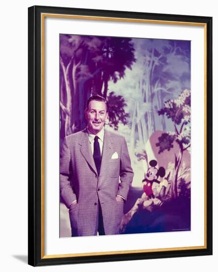 Walt Disney Posing Against Landscape Backdrop Containing Mickey Mouse-Alfred Eisenstaedt-Framed Premium Photographic Print