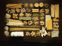 Many Different Types of Pasta on Dark Wooden Background-Walter Cimbal-Photographic Print