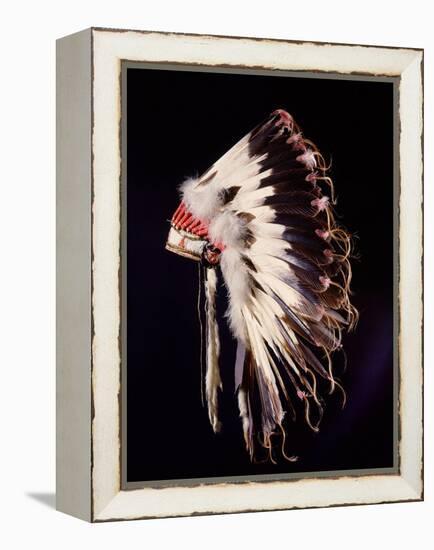 War bonnet of eagle tail feathers, each feather signifying a specific war honour-Werner Forman-Framed Premier Image Canvas