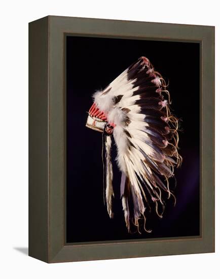 War bonnet of eagle tail feathers, each feather signifying a specific war honour-Werner Forman-Framed Premier Image Canvas