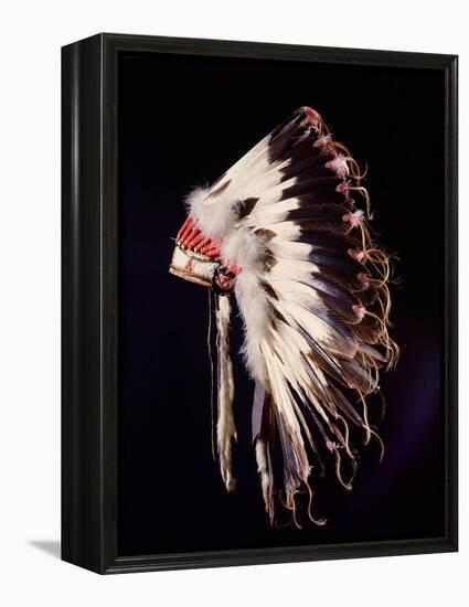 War bonnet of eagle tail feathers, each feather signifying a specific war honour-Werner Forman-Framed Premier Image Canvas