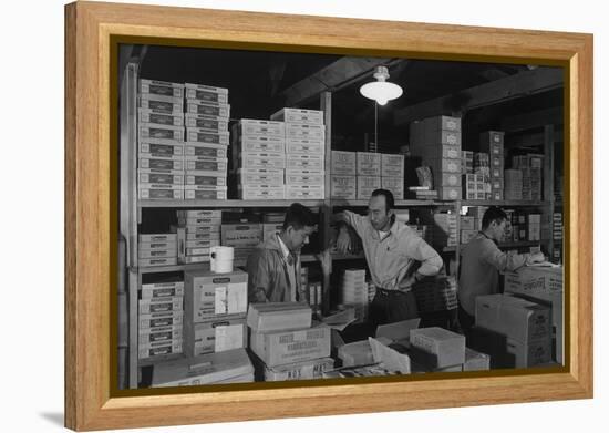 Warehouse manager M. Ogi with S. Sugimoto, manager of Co-op at Manzanar, 1943-Ansel Adams-Framed Premier Image Canvas