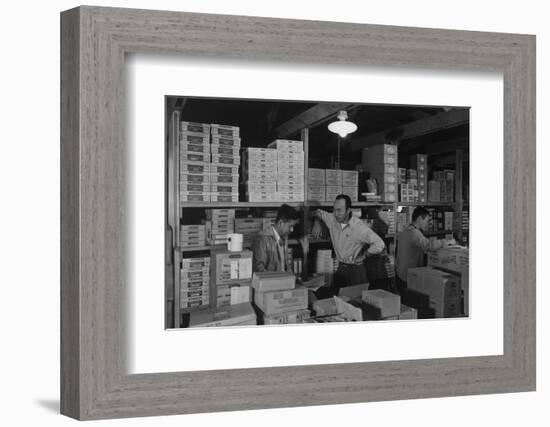 Warehouse manager M. Ogi with S. Sugimoto, manager of Co-op at Manzanar, 1943-Ansel Adams-Framed Photographic Print