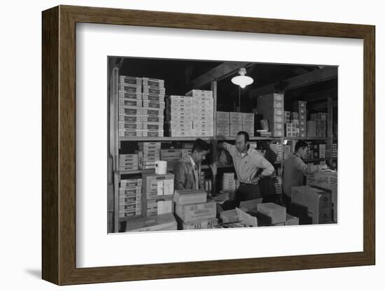 Warehouse manager M. Ogi with S. Sugimoto, manager of Co-op at Manzanar, 1943-Ansel Adams-Framed Photographic Print