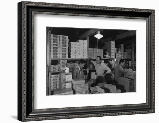 Warehouse manager M. Ogi with S. Sugimoto, manager of Co-op at Manzanar, 1943-Ansel Adams-Framed Photographic Print