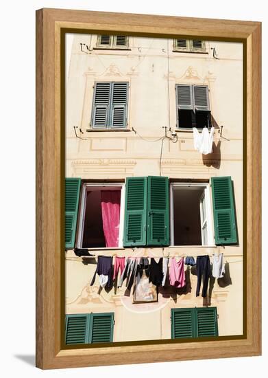 Washing hanging out of a window-Julian Castle-Framed Stretched Canvas