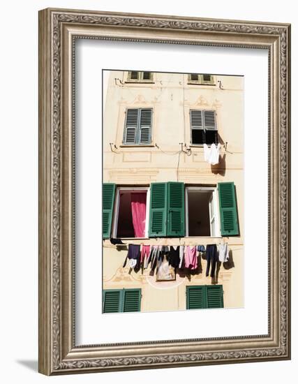 Washing hanging out of a window-Julian Castle-Framed Photo