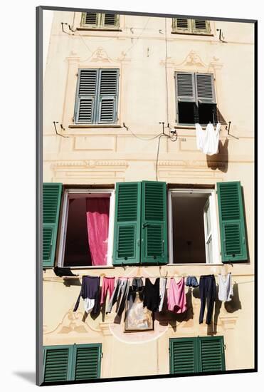 Washing hanging out of a window-Julian Castle-Mounted Photo