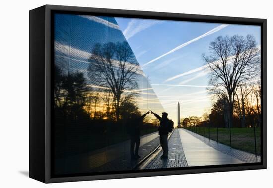 Washington DC - A Veteran Looks for a Name at Vietnam Veterans Memorial Wall at Sunrise-Orhan-Framed Premier Image Canvas