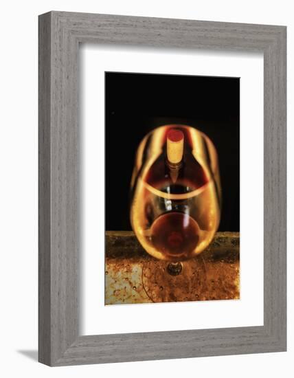 Washington State, Walla Walla. the Illusion of a Bottle Inside a Glass in a Walla Walla Winery-Richard Duval-Framed Photographic Print