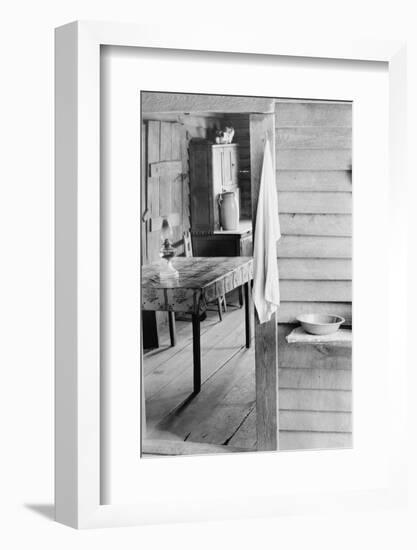 Washstand in the dog run and kitchen of sharecropper a cabin in Hale County, Alabama, c.1936-Walker Evans-Framed Photographic Print