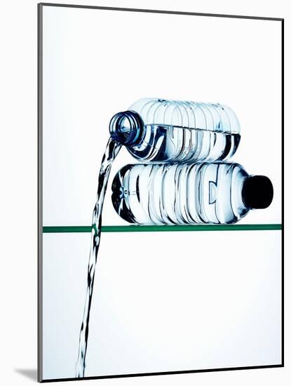 Water Running Out of a Plastic Bottle-Hermann Mock-Mounted Photographic Print
