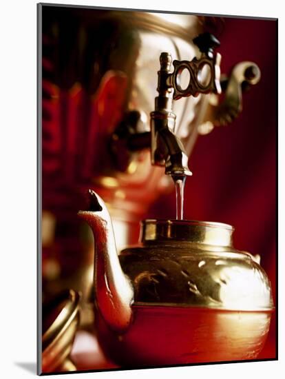 Water Running out of Samovar into a Pot-Michael Boyny-Mounted Photographic Print